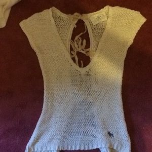 Woven cream colored open bank shirt.